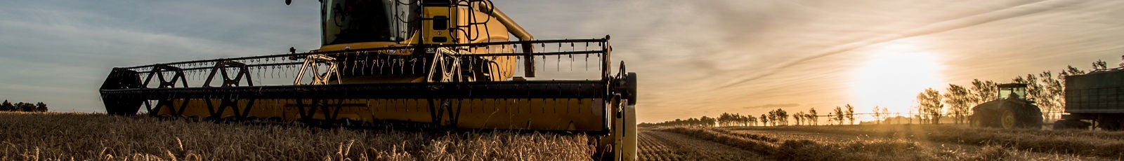 Tractor in Agricultural Field Image of tractor/combine harvester in a field.