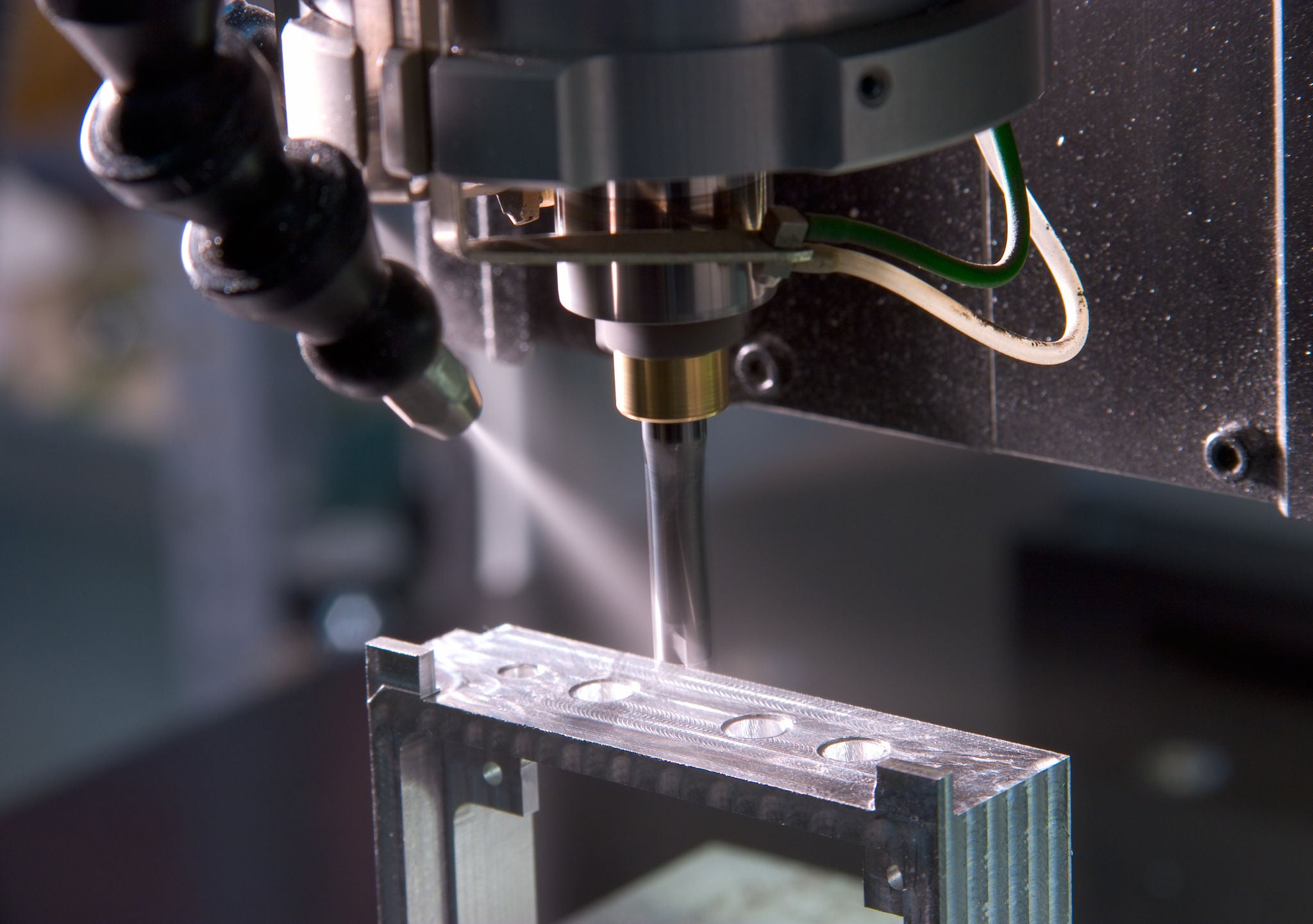 IN_MT_Moulding-machine_Fotolia_2578478_L.jpg Machine Tool, Moulding Machine, factory molding machine workshop. close up