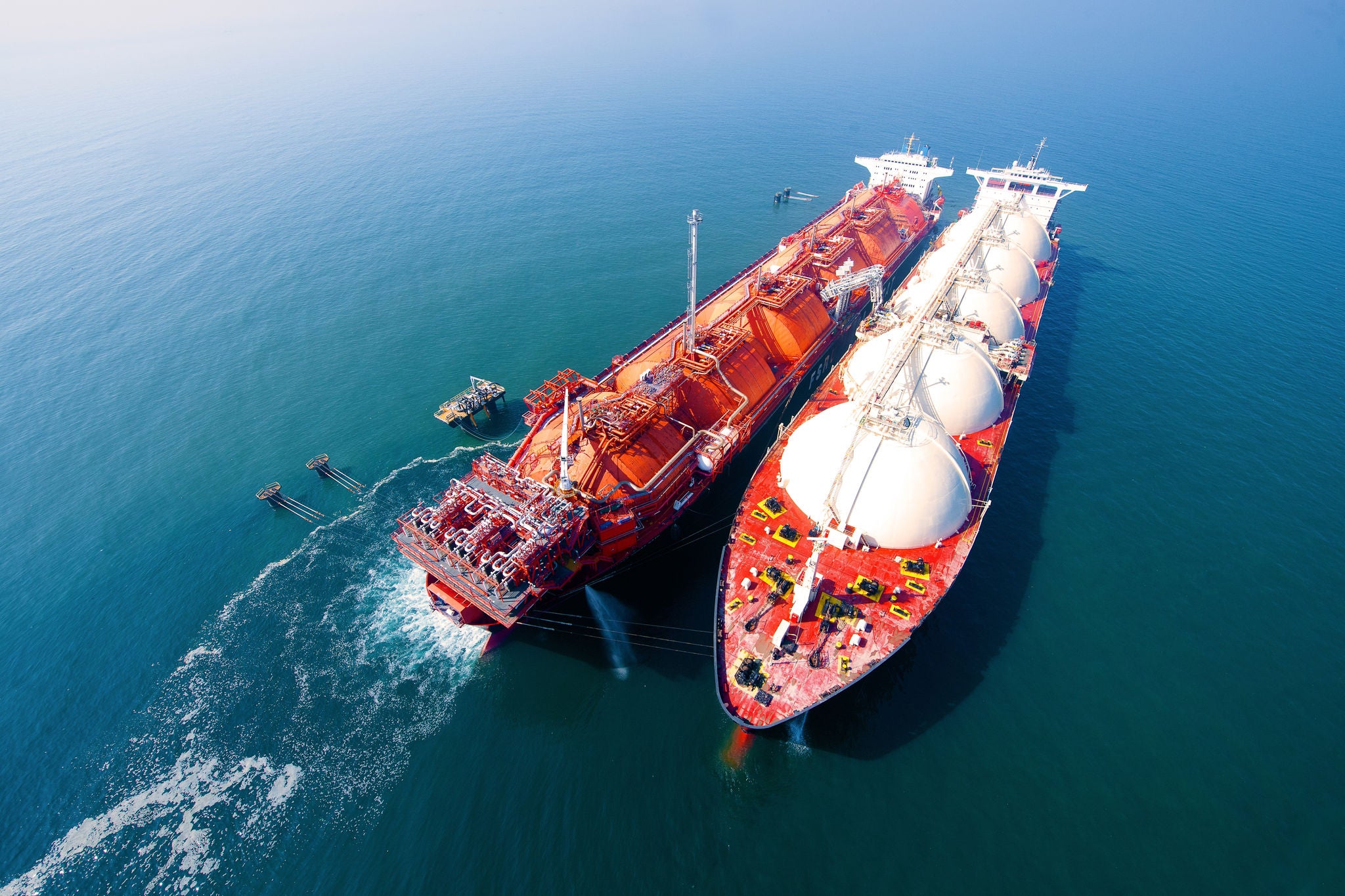 IN_Marine-Industry_Shutterstock_2270713683.jpg LNG gas oil tankers are transferring gas to another ship in the middle of the sea