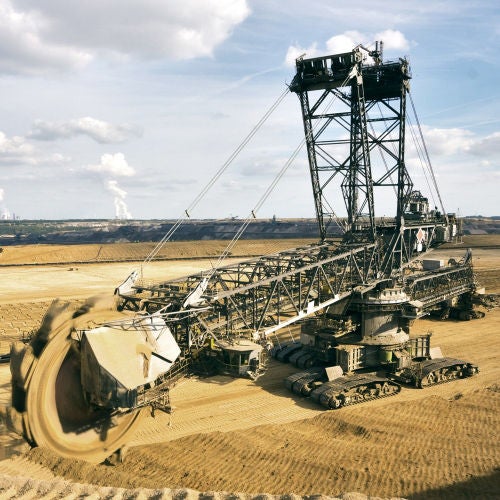 Quarry, Mining , Construction, Digging, bucket wheel excavator Giant bucket wheel excavator taking away the layers of ground before digging the brown coal. Largest open pit lignite mine in Europe. Power stations at horizon transform the coal to electricity.