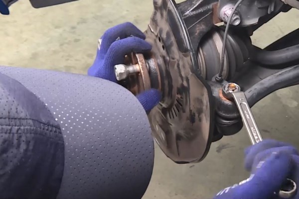 Wheel Bearing Replacement - In case the nut is rotating with the ball joint, press the ball joint further into the knuckle arm.